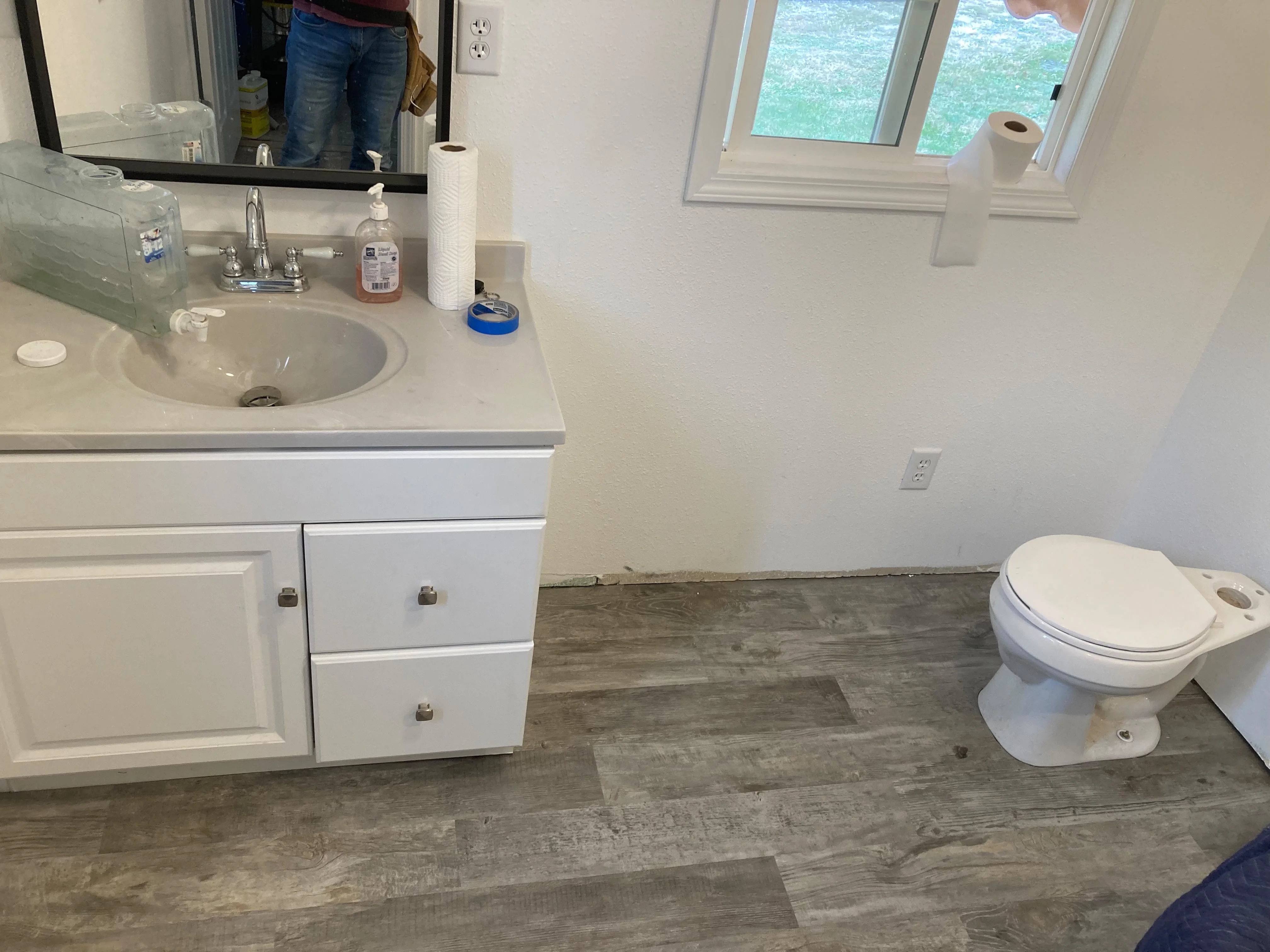 Bathroom vanity and new vinyl plank flooring installation