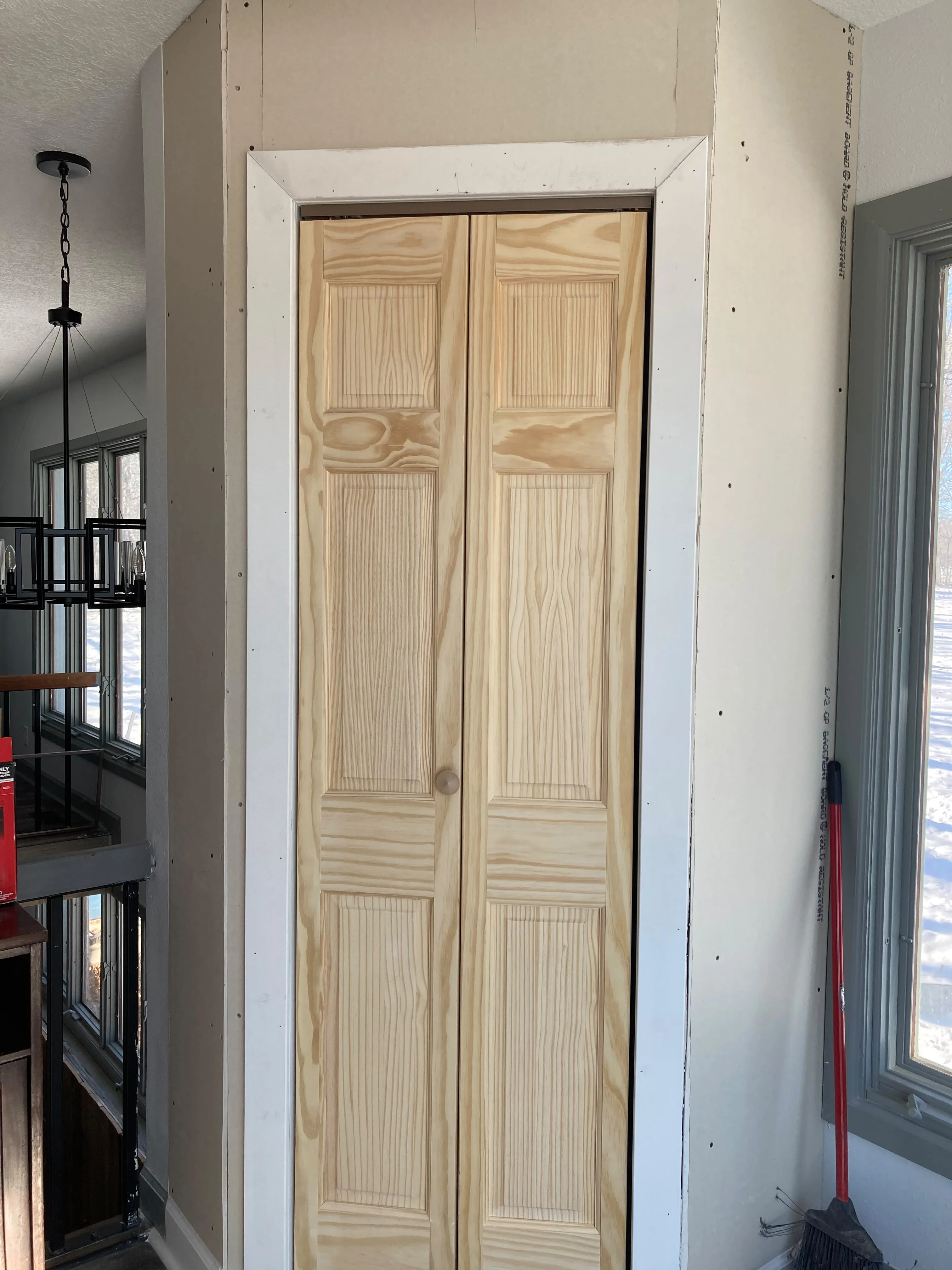 New pine bifold closet doors installed in a Des Moines home