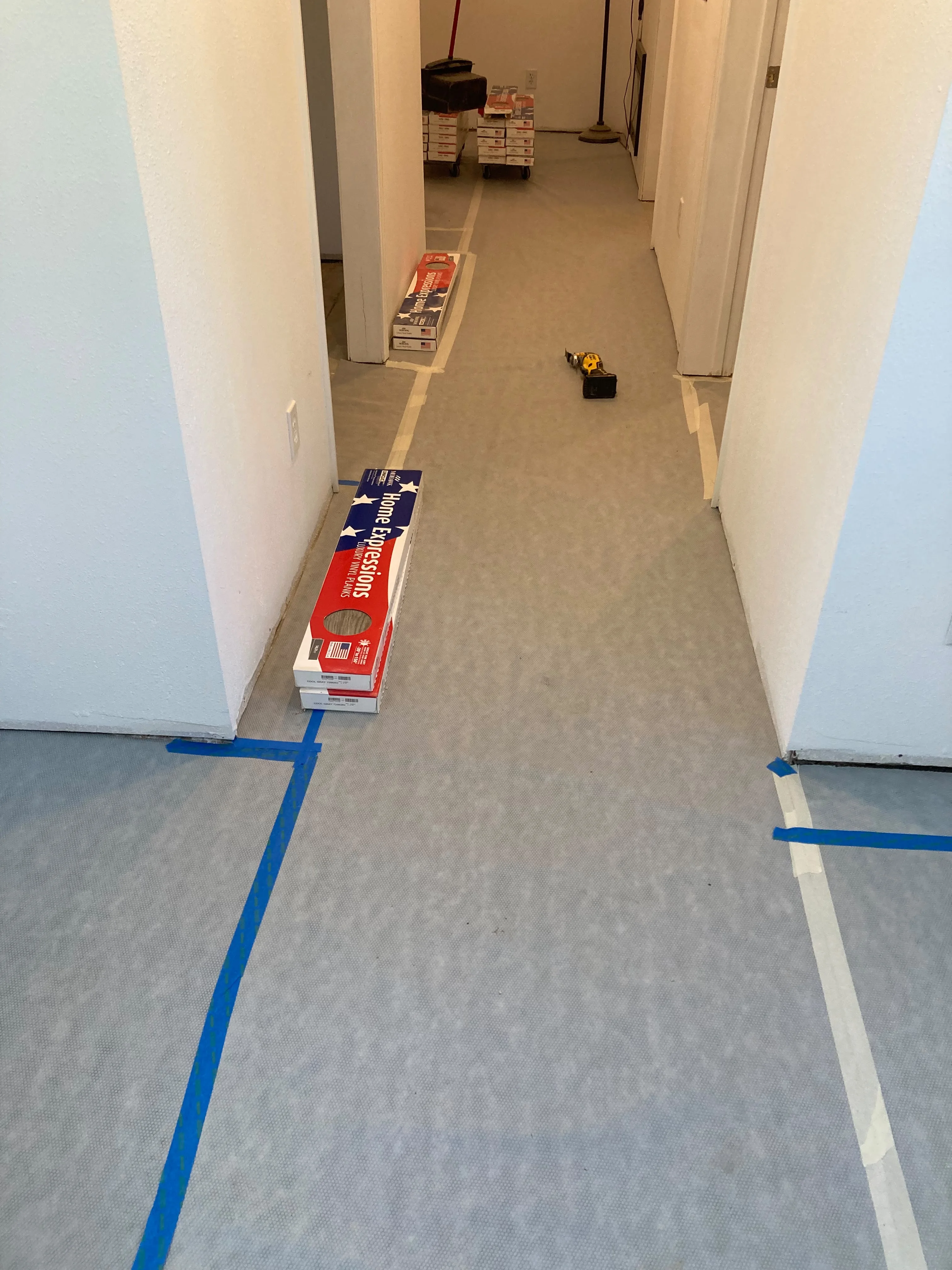 Luxury vinyl plank flooring staged for installation