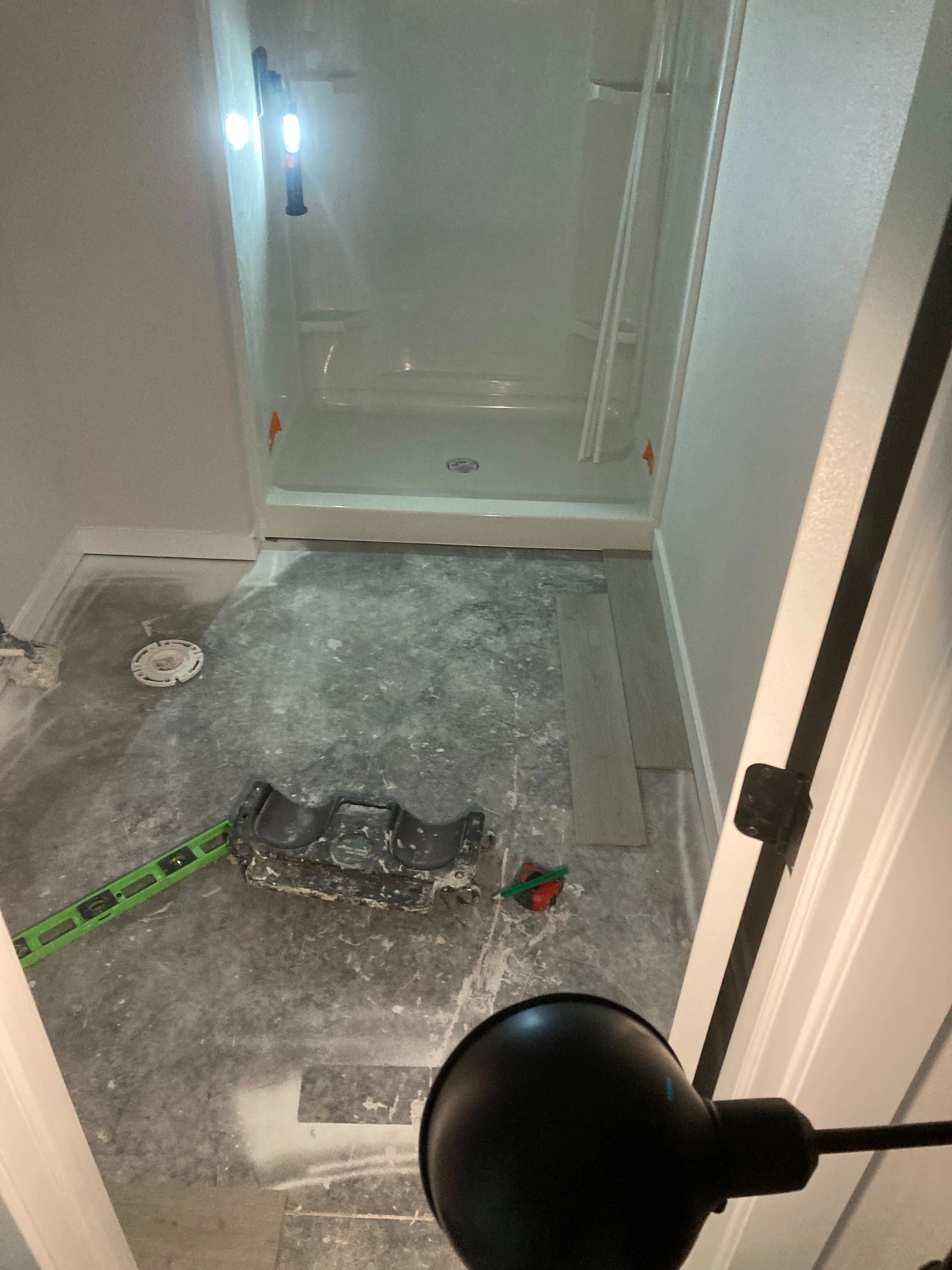 New shower stall and tile flooring installation