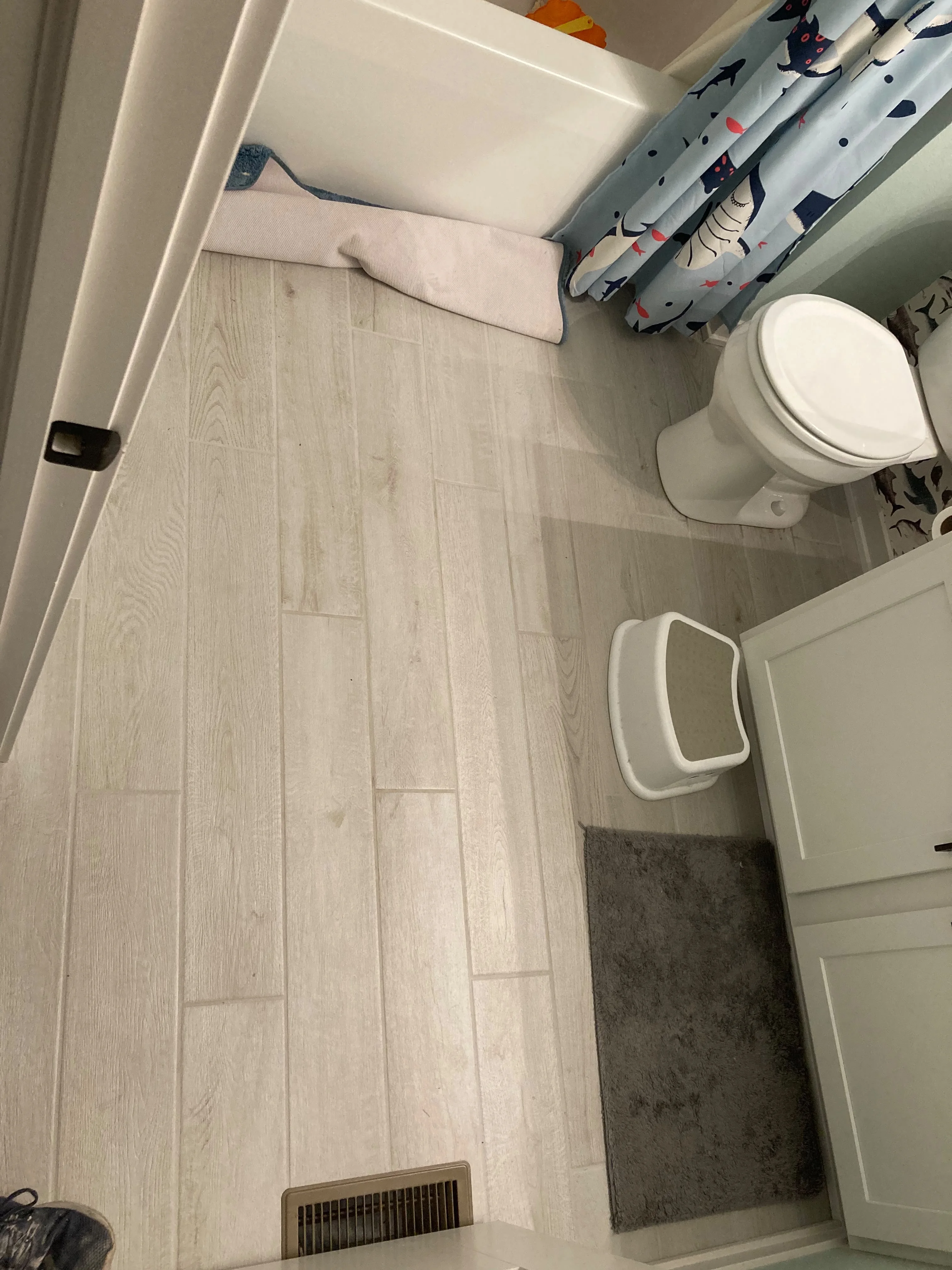 Finished bathroom with new tile flooring