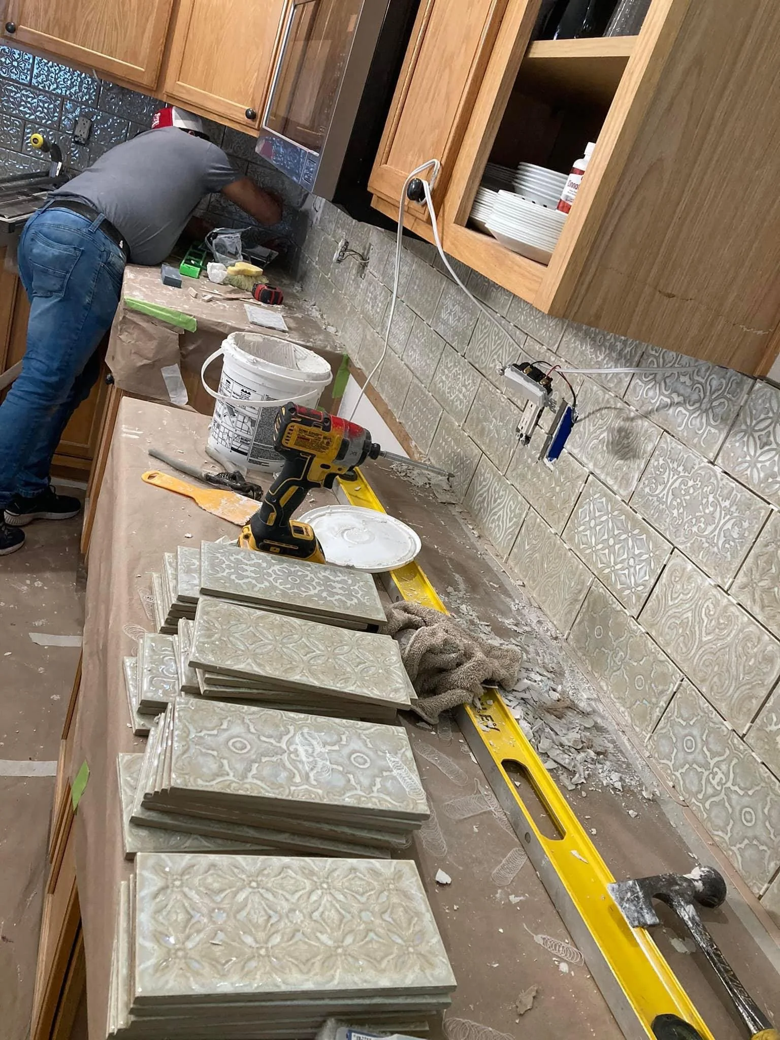 Kitchen tile backsplash installation in progress