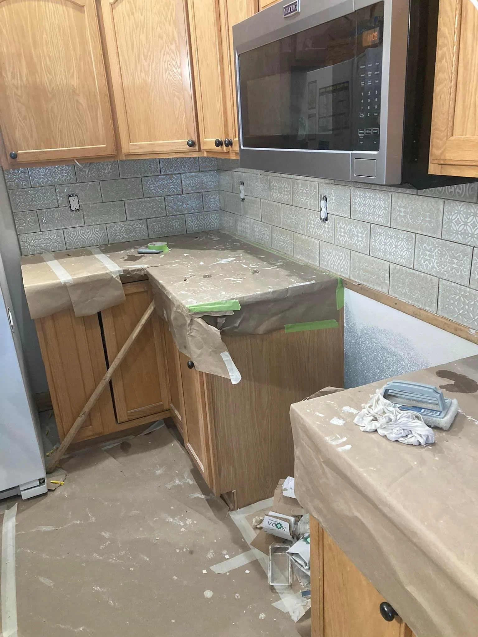 Finished kitchen tile backsplash and cabinetry