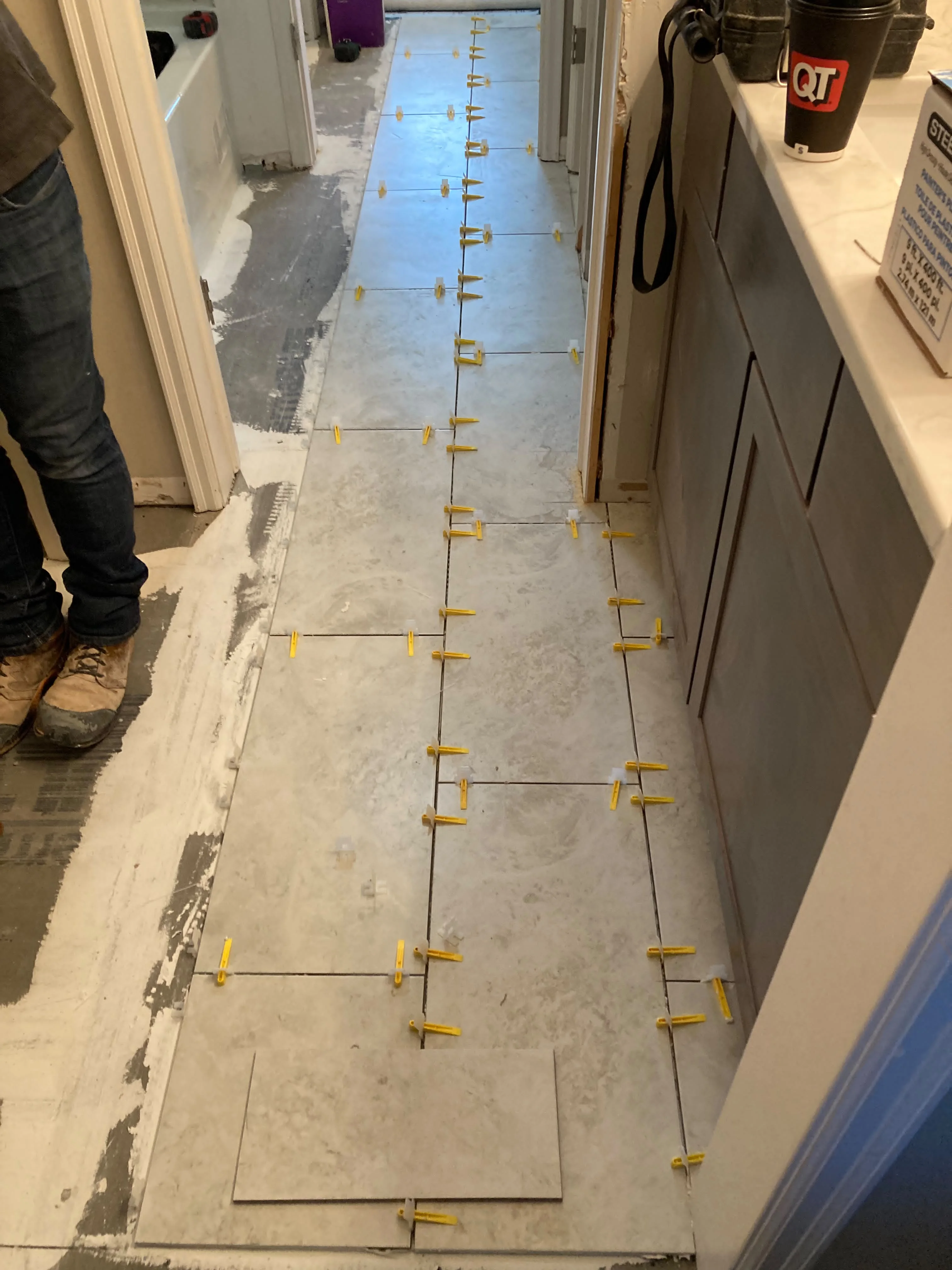 New tile flooring installation in a hallway